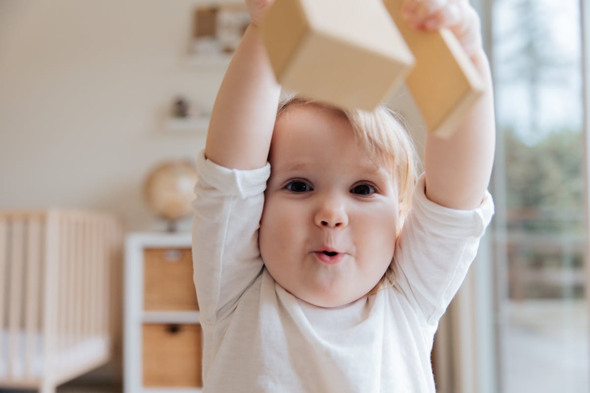 Happy baby in crib